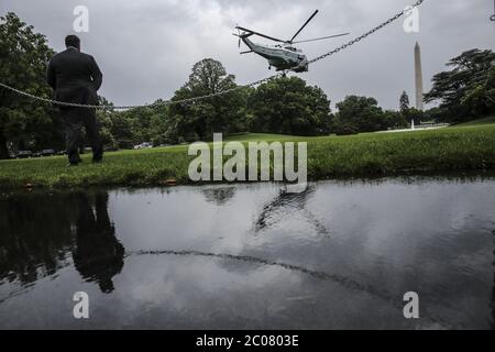 Washington, United States. 11th June, 2020. Marine One carrying President Donald Trump departs from the South Lawn of the White House in a heavy rain on Thursday, June 11, 2020 in Washington, DC. Trump is off to Texas and then his golf club in New Jersey. Photo by Oliver Contreras/UPI Credit: UPI/Alamy Live News Stock Photo