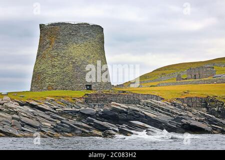 Broch of Mousa;  which is a preserved Iron Age round tower on the rocky coastline. It is on the island of Mousa in Shetland, Scotland. Stock Photo