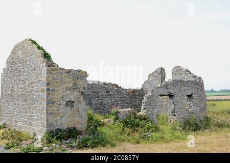 East Aberthaw is a quiet beach next to a huge power station, with derelict cottages and farmland Stock Photo