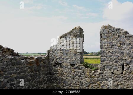 East Aberthaw is a quiet beach next to a huge power station, with derelict cottages and farmland Stock Photo