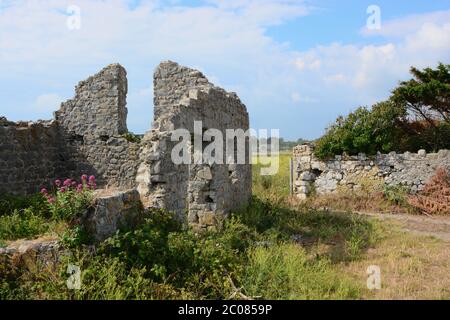 East Aberthaw is a quiet beach next to a huge power station, with derelict cottages and farmland Stock Photo