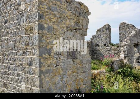 East Aberthaw is a quiet beach next to a huge power station, with derelict cottages and farmland Stock Photo