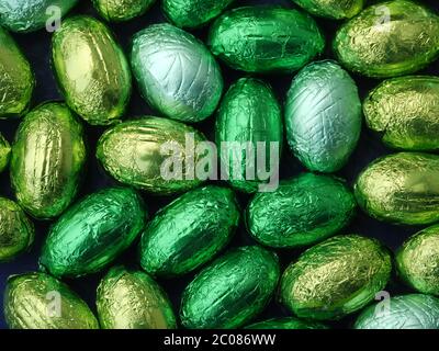 chocolate eggs in green tinfoil Stock Photo