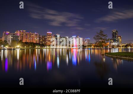 Night skyline of Orlando, Florida, with Lake Eola in the foreground Stock Photo