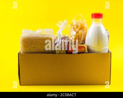 Food staples delivery or donation box concept Stock Photo