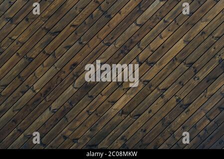 Wood Texture Background dark brown color 45 degree. texture of old wooden planks at an oblique angle. Diagonal background brown old wood planks. Stock Photo