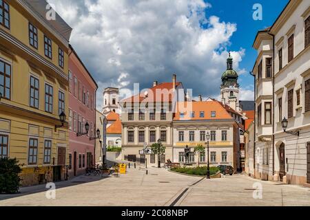 Cozy little baroque square in the center of Gyor, with the bronze sculpture of Nimrod, in the background the Cathedral tower and the Bishop-Lookout T Stock Photo