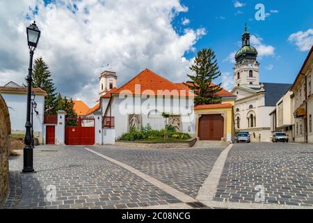 Cozy little square in the downtown of Gyor. Hungary. In the background the Cathedral Tower and the Bishop-Lookout Tower. Stock Photo