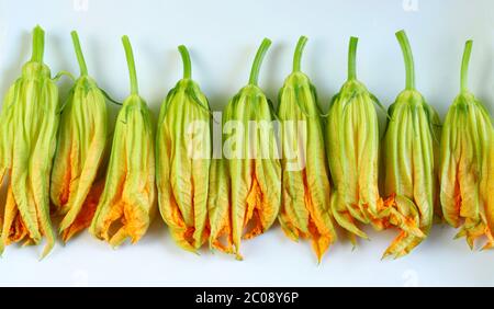 Fresh zucchini flowers background. Top view. Organic food. Stock Photo