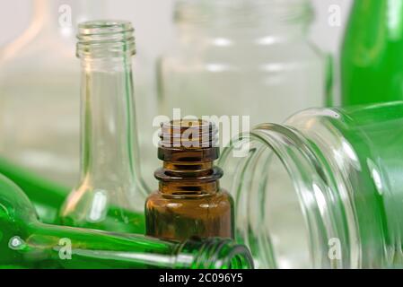 Old empty bottles and glasses for recycling Stock Photo