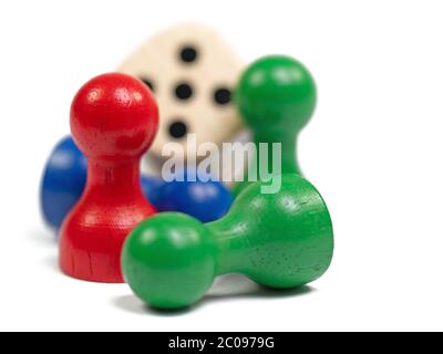 Colorful wooden cones and dice against white background Stock Photo