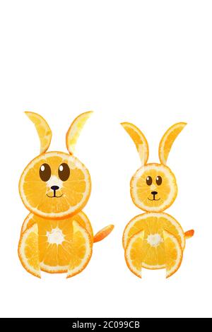 Healthy eating. Funny couple of rabbit made of the orange slices. Stock Photo