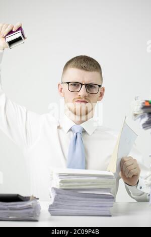 Classic white collar stamps on stack of unfinished papers overloaded with work Stock Photo