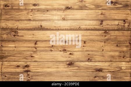 Light brown wood texture background viewed from above. The worn wooden planks are stacked horizontally. Design asset for a wall, floor, table etc. Stock Photo