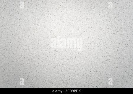 White quartz background countertop texture. This light background is taken from a bright off-white quartz kitchen counter.