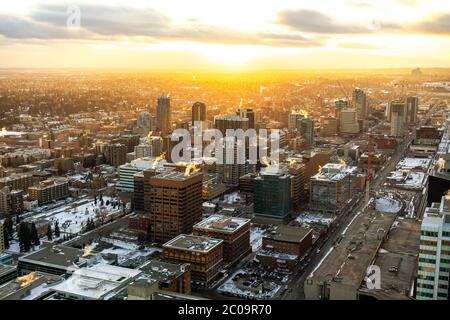 Sunset over the city of Calgary in winter. Taken from the Calgary Tower, overlooking the south-west downtown side of the urban city. Stock Photo