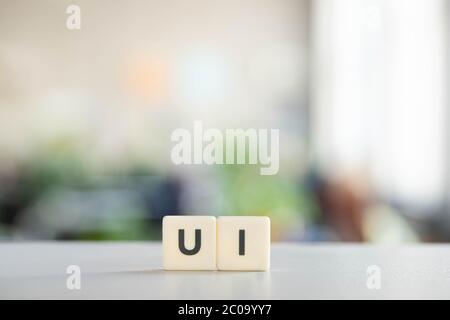 white cubes with ui lettering on office desk Stock Photo