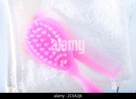 hairs brushes and baby clothes Stock Photo