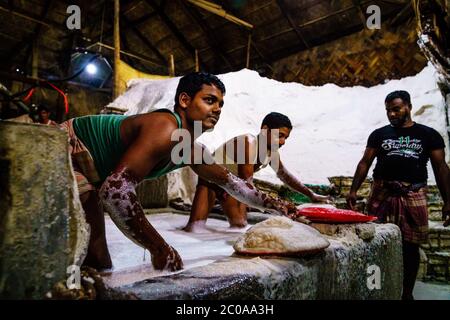 Chittagong, Bangladesh, December 22, 2017: Hard labor in a salt factory in Chittagong, Bangladesh Stock Photo