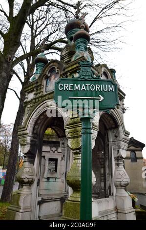 A direction sign in a cemetery, which gives the direction of a ...