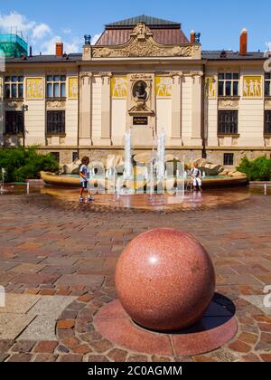 Szczepanski Square with fountain and Palace of the Arts in Krakow, Poland Stock Photo