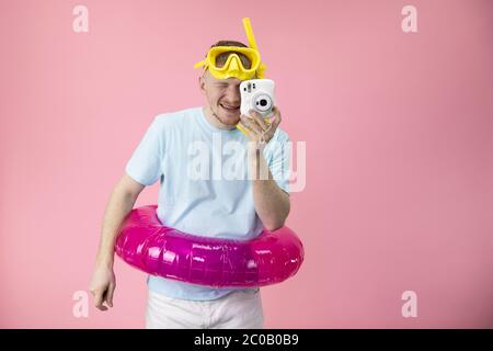 Download Happy Male With Yellow Swimming Mask And With Rubber Ring Make Instant Photo Stock Photo Alamy Yellowimages Mockups