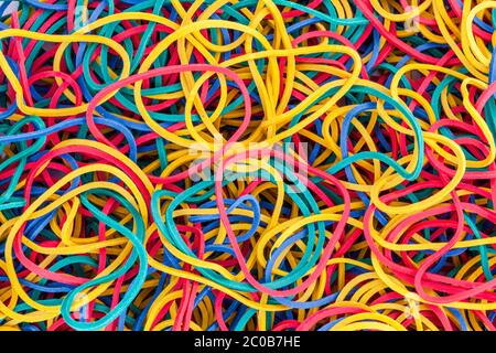 Multicolored bright elastic rubber bands colourful background in a stack heap stock photo Stock Photo