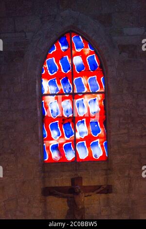 Stained glass window, The Church of Notre-Dame-des-Sablons in Aigues-Mortes, Gard, France Stock Photo