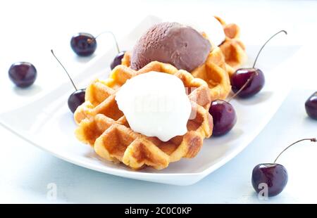 Waffle with ice cream , chocolate and cherries Stock Photo