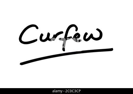 The word Curfew handwritten on a white background. Stock Photo