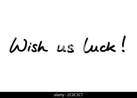 Wish us luck! handwritten on a white background. Stock Photo