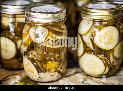 Homemade pickles in mason jars at Farmer's Market Stock Photo