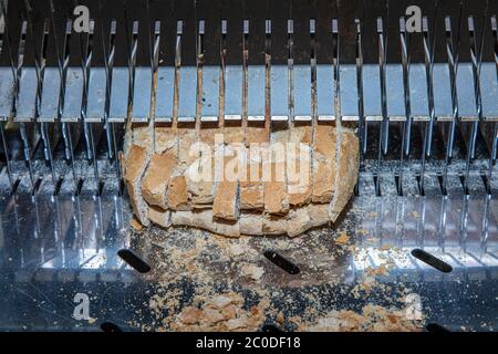 Sliced Bread in Cutting Machine / Industrial Bread Slicer in Supermarket  with Bread Crumbs. Ready to Use Stock Photo - Alamy