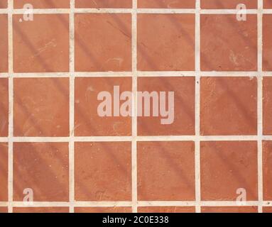 Terracotta floor square tile background texture Stock Photo