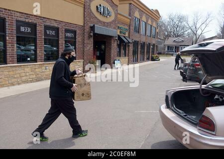 Kowalski's Market charming door greeter delivers two pots of