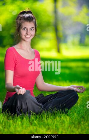 Young woman doing yoga exercises Stock Photo