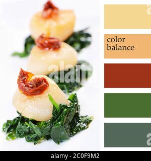 sea scallops with spinach and tomatoes Stock Photo