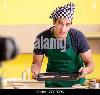 The young chef blogger explaining food preparation Stock Photo