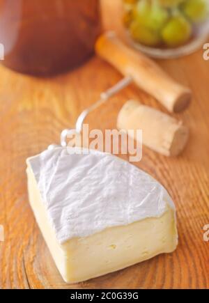 Piece and wheel of traditional Normandy soft cheese Camembert with ...