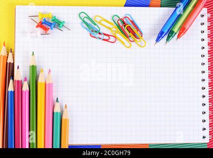 Color pencils on  paper with notebook Stock Photo
