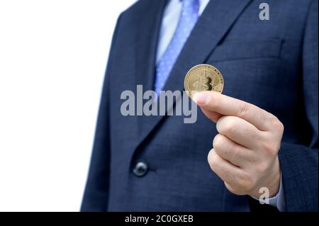 Golden Bitcoin in a man's hand. blockchain and new virtual currency. Stock Photo