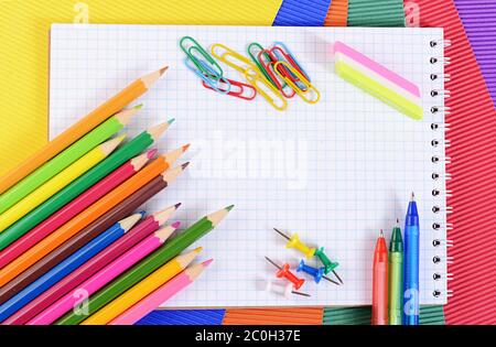 Color pencils on  paper with notebook Stock Photo