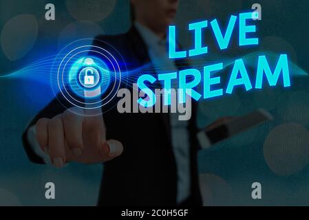 Writing note showing Live Stream. Business concept for to broadcast a video or audio material with the use of Internet Stock Photo