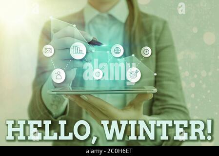 Writing note showing Hello, Winter. Business concept for greeting used when the cold season of the year passes by Stock Photo