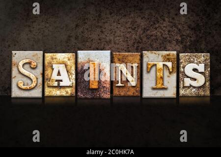 Saints Letterpress Concept on Dark Background Stock Photo