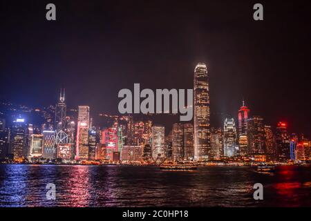 Enlightened Hong Kong Skyline from the Tsim Sha Tsui Promenade during the night Stock Photo