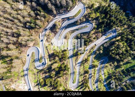 Top down view of the famous Maloja pass winding road in the alps in Canton Graubünden in Switzerland Stock Photo