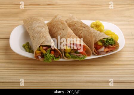 Chapatti roti or Flat bread, curry chicken, biryani rice, salad, masala ...