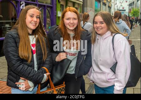 Cork, Ireland. 12th June, 2020. Penneys Clothes Stores around the country with street access reopened this morning. There was a queue of 250 people at Cork's Patrick Street store, the first people in the queue arrived at 3am. Waiting for Penneys to open since 8.30 were Aoife Barrett, Aoife Coughlan and Chloe Murphy, all from Douglas. Credit: AG News/Alamy Live News Stock Photo