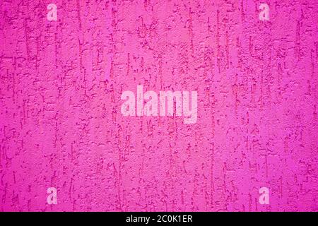 Background of magenta stone wall with textured drips. Stock Photo